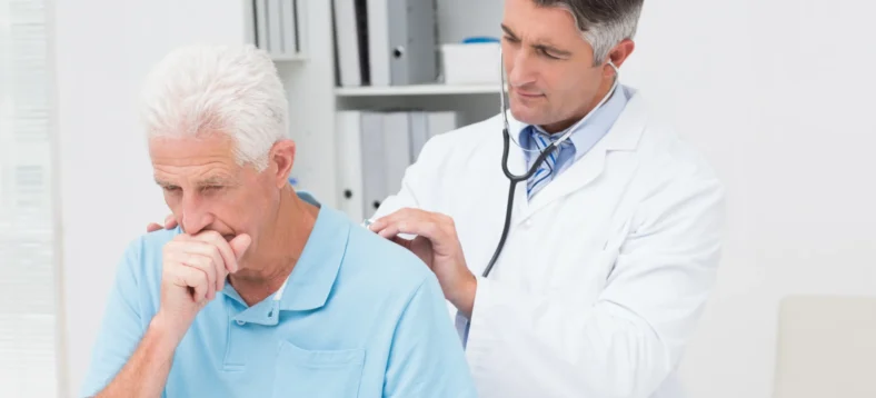 doctor-examining-coughing-senior-patient